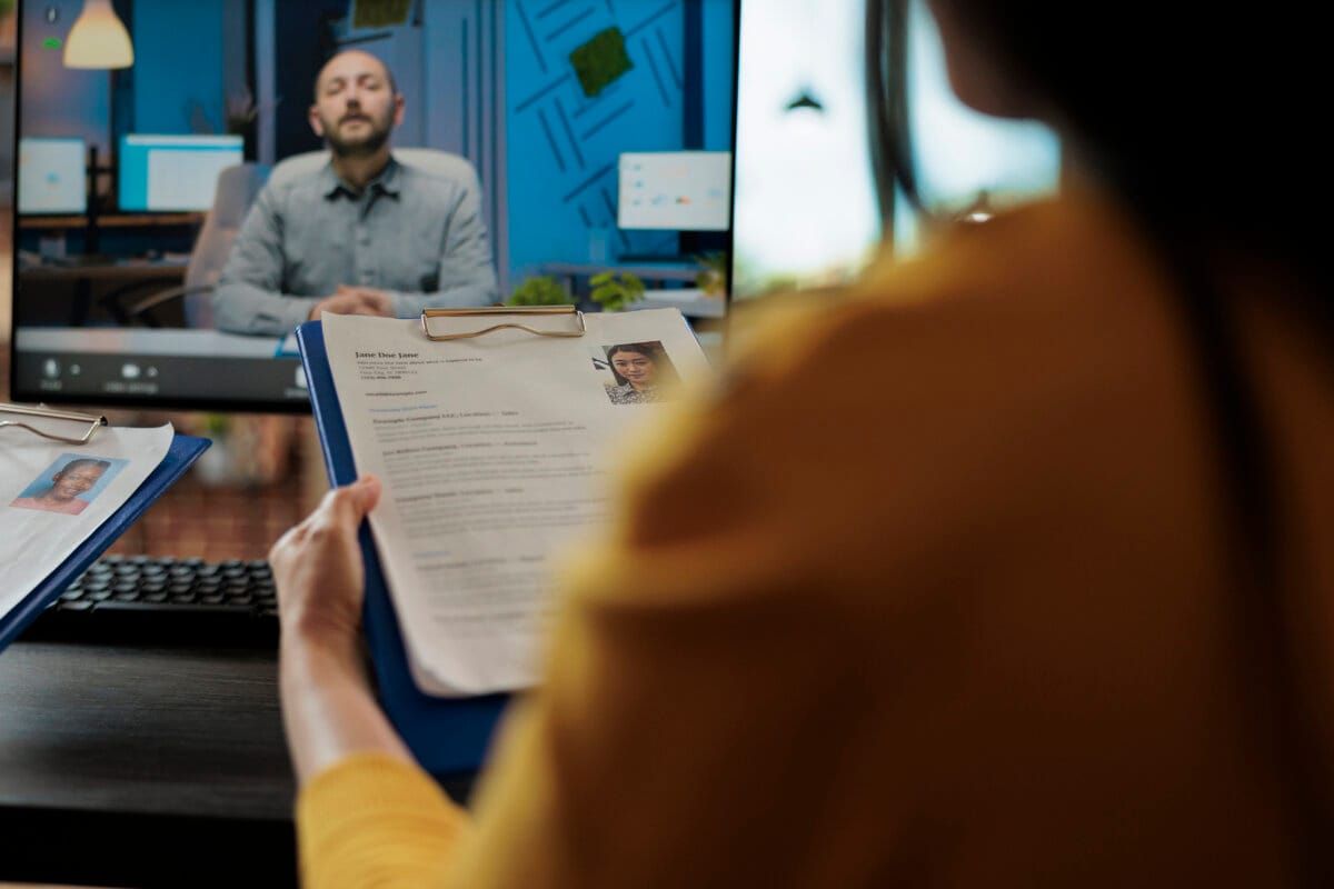 Businesswoman reading freelancer cv discussing hiring offer