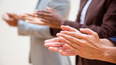 Hands of business people applauding speaker